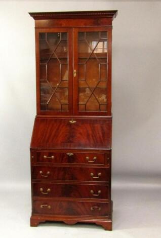 A Georgian style mahogany bureau bookcase