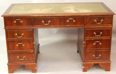 A mahogany twin pedestal desk