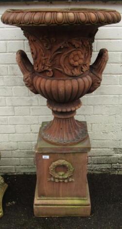 A terracotta campana garden urn