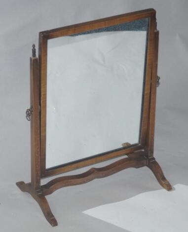 An Edwardian mahogany swing frame toilet mirror