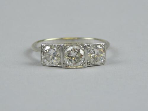 An Art Deco three stone diamond ring