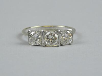 An Art Deco three stone diamond ring