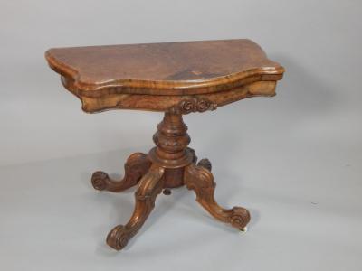 A Victorian figured walnut card table