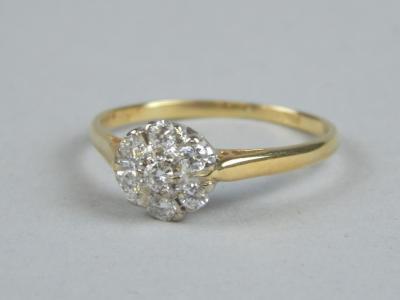 An 18ct gold diamond floral cluster ring