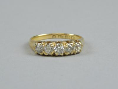 An 18ct gold five stone diamond ring