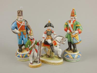 Four various Russian 20thC tin glazed figures of soldiers