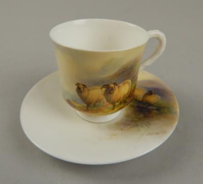 A 20thC Royal Worcester style cup and saucer