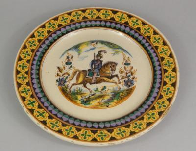 A Continental tin glazed charger