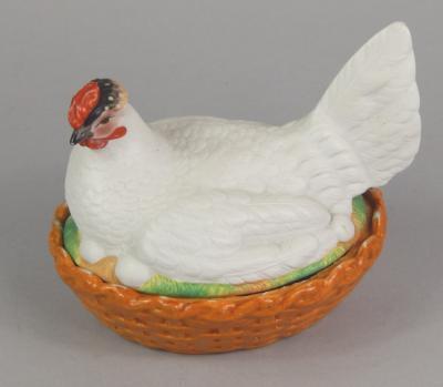 A 19thC bisque and glazed porcelain egg holder