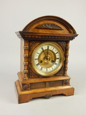 A late 19thC German walnut and beech mantel clock