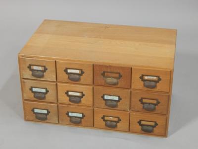 A bank of twelve oak Retro style index drawers