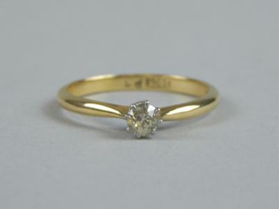 A diamond solitaire ring