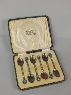 A set of six silver Arts and Crafts style coffee spoons