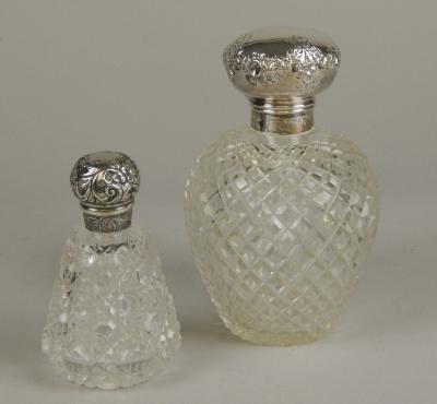 Two early 20thC silver mounted scent bottles