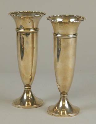 A pair of early 20thC silver specimen vases