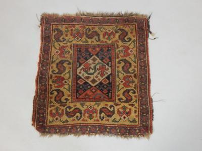 A Turkish Milas mat or small rug with a geometric design