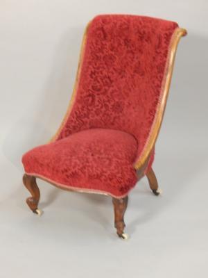 A Victorian walnut nursing chair