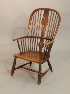 A 19thC Windsor open armchair with a pierced splat