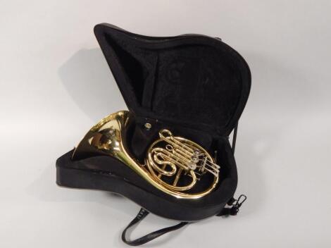 An Elkhart 100GFH brass French horn