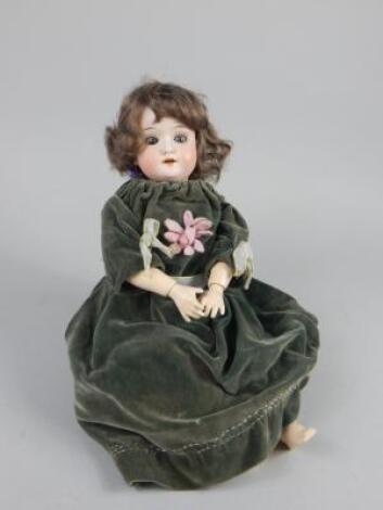 A Schoenau & Hoffmeister bisque headed doll