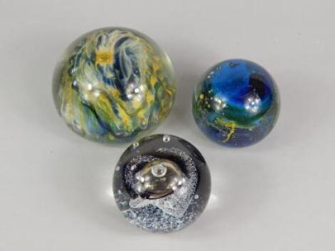 Three paperweights