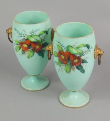 A pair of Victorian pale green opaque glass vases