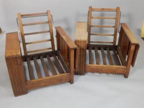 A pair of unusual Art Deco oak reclining armchairs