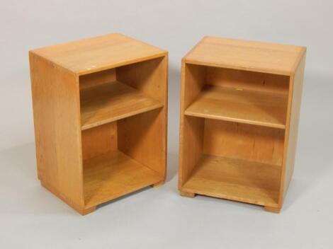 A pair of military issue light oak bedside cabinets