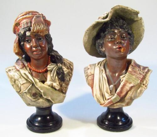 A pair of 19thC Continental Blackamoor earthenware busts of a lady and gentleman