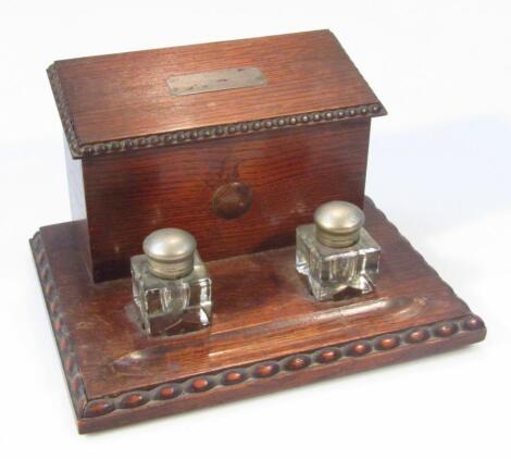 A 1930's oak desk tidy