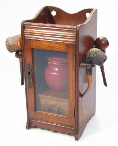 An early 20thC oak smoker's cabinet