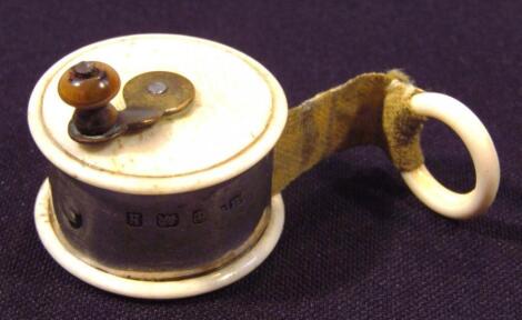 An Edwardian silver and bone tape measure