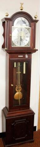 A modern long case clock in cherry wood style case