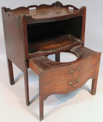 An 18thC mahogany serpentine fronted commode