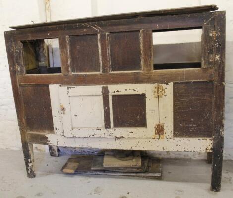 A 19thC oak stained pine hutch court cupboard