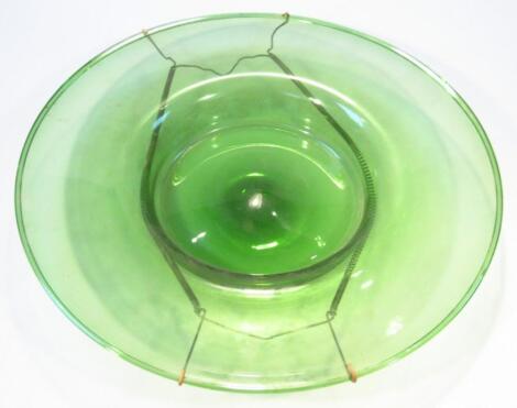 A 20thC green glass armada style offertory dish