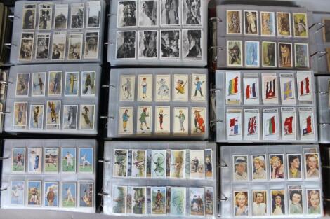 A quantity of various cigarette cards