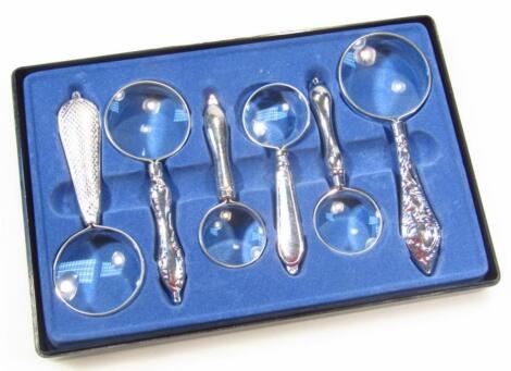 A 20thC cased magnifying glass set