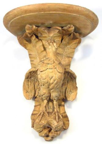 A late 19thC/early 20thC heavily carved pine wall sconce