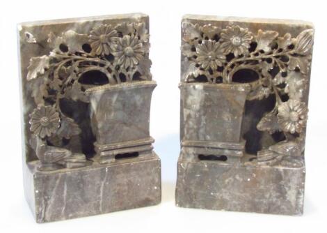 A pair of early 20thC soapstone book ends