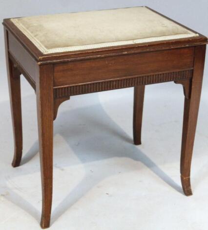 An Edwardian mahogany piano stool