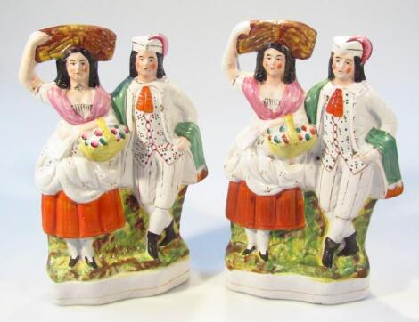 A pair of Victorian Staffordshire flat back figures of a farmer and wife