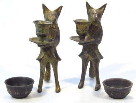 A pair of unusual Nesta style candlesticks