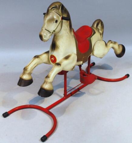 A mid 20thC Mobo hollow metal child's rocking horse