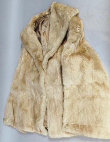 An early 20thC ladies three quarter length fur coat