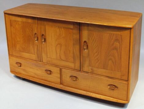 An Ercol light yew wood finish sideboard