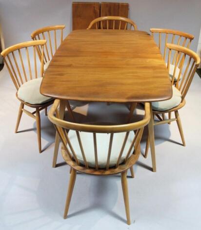 A 20thC Ercol light yew wood finish dining table