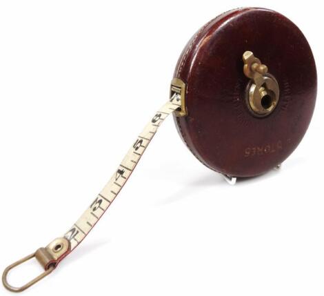 An early 20thC leather tape measure