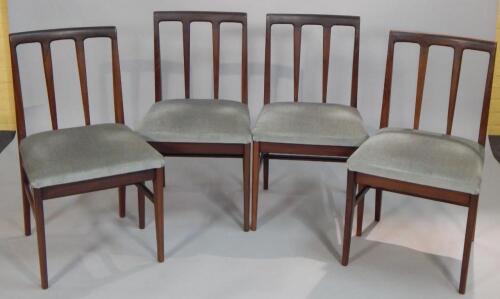 A set of four Retro style teak dining chairs