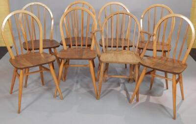 A set of eight Ercol light ash and elm rail back dining chairs